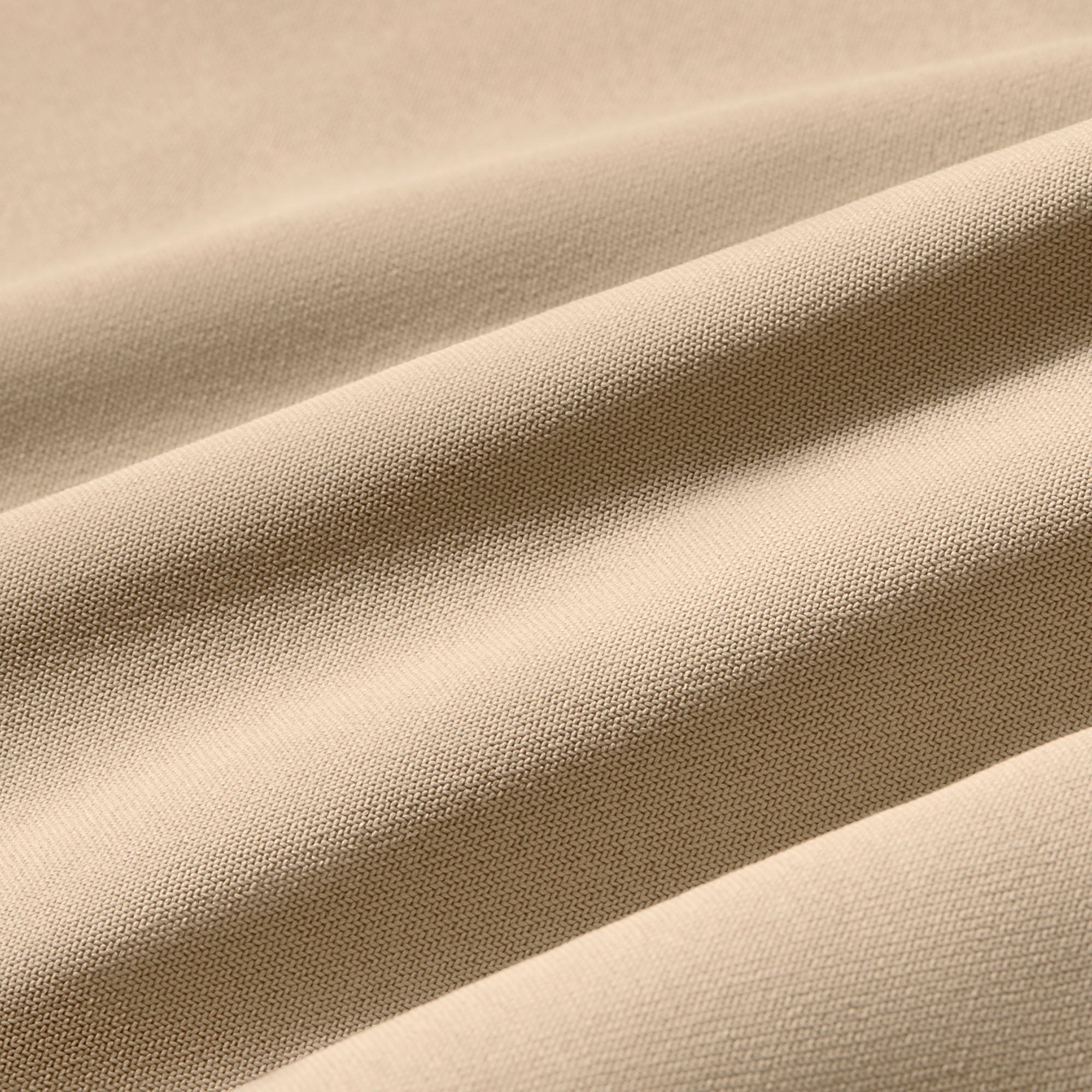 Close-up of beige fabric with visible texture