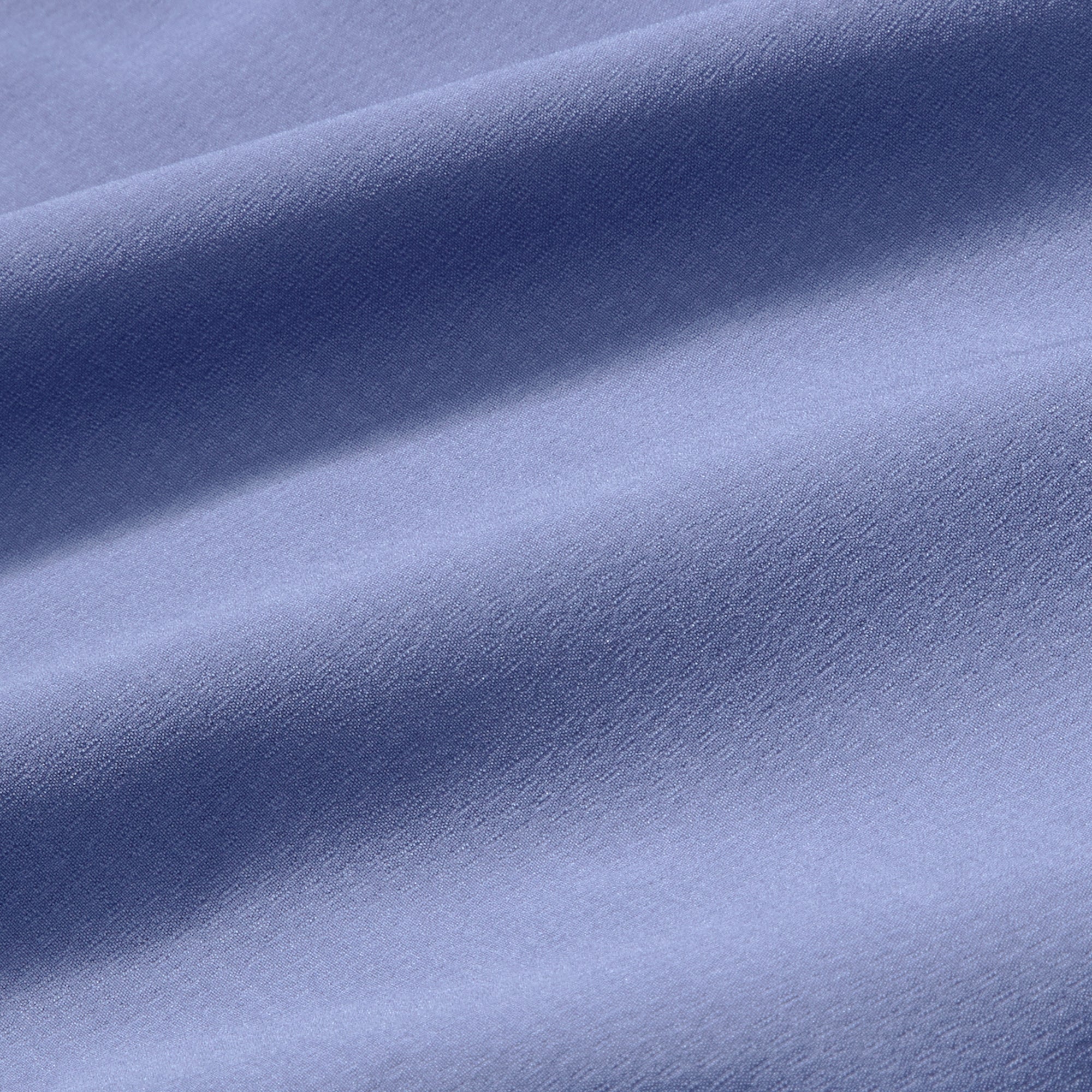 Close-up of blue fabric with folds