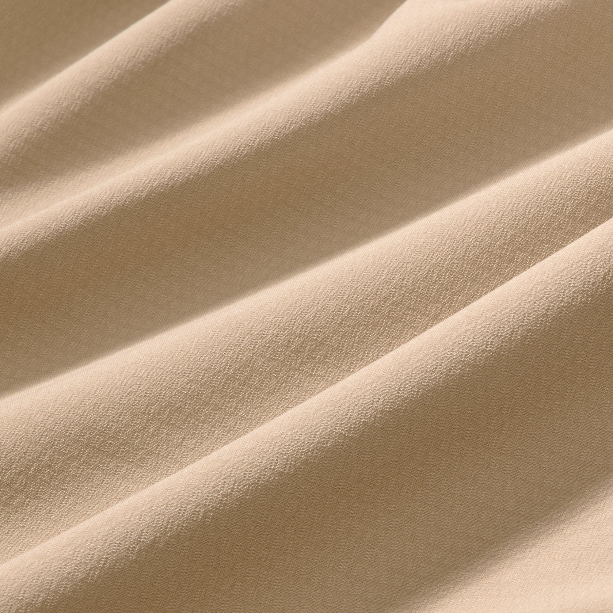 Close-up of beige fabric with folds