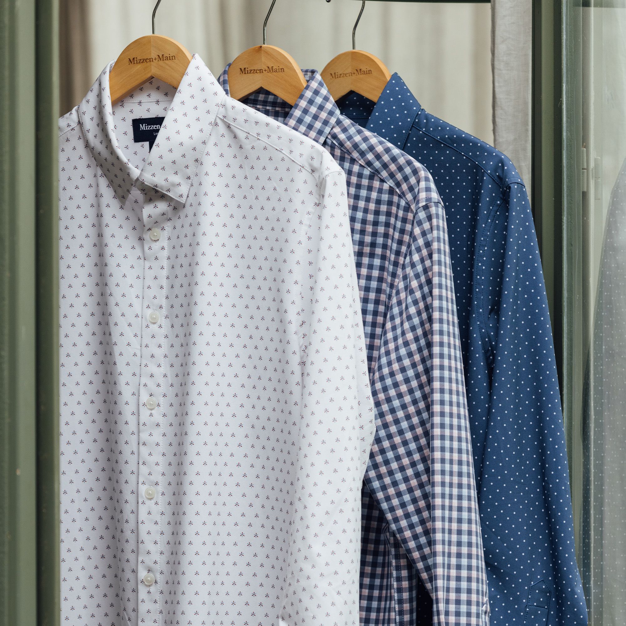 Dress shirts hanging on a clothes rail