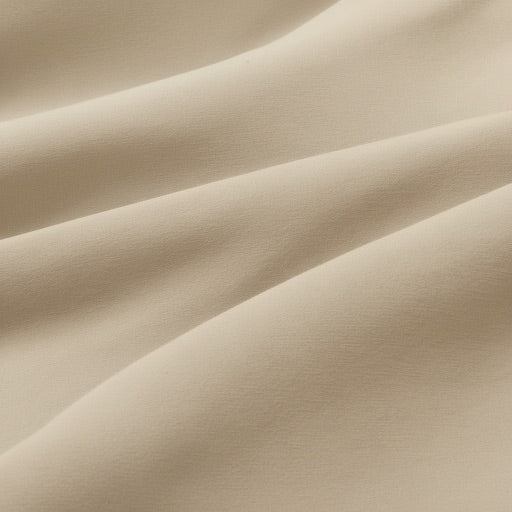 Close-up of beige fabric with folds