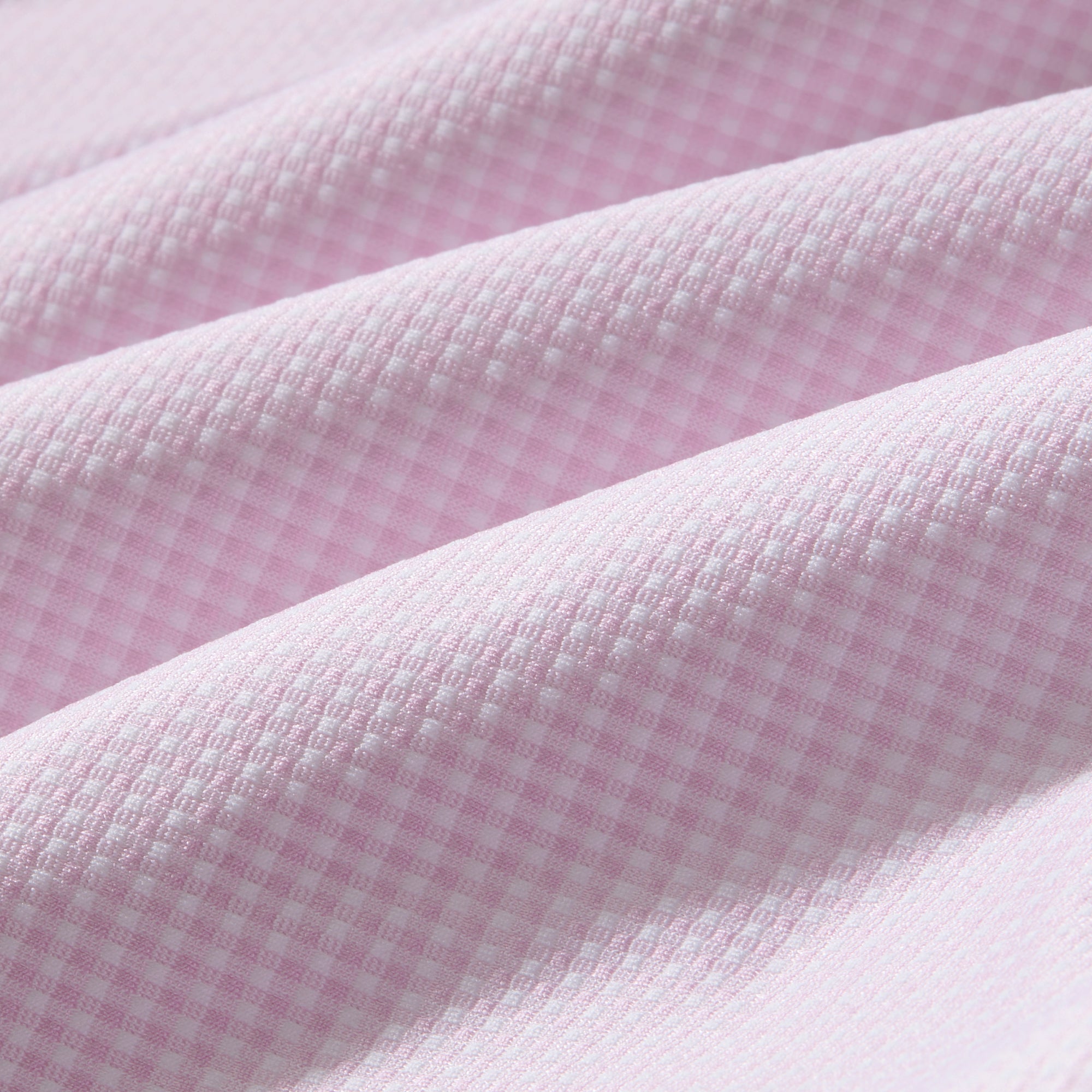 Close-up of pink textured fabric with a soft texture